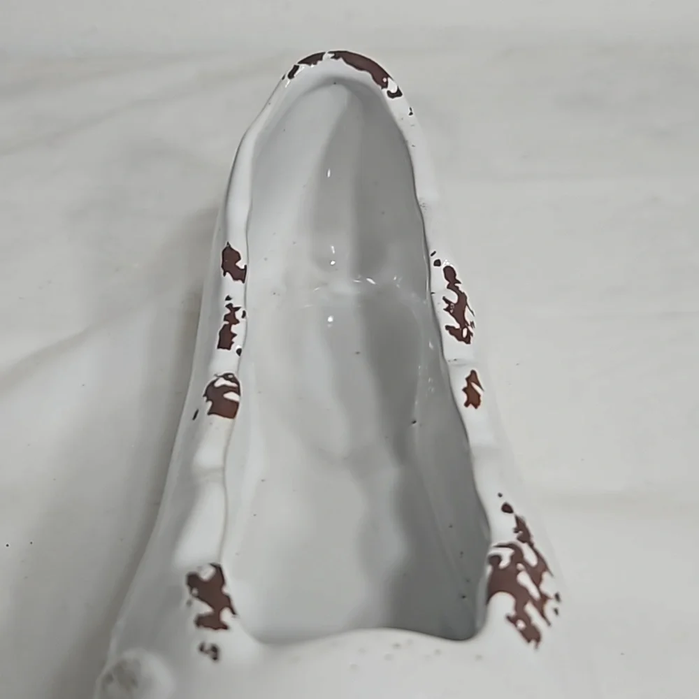 Decorative ceramic ballet shoe vase with vine design